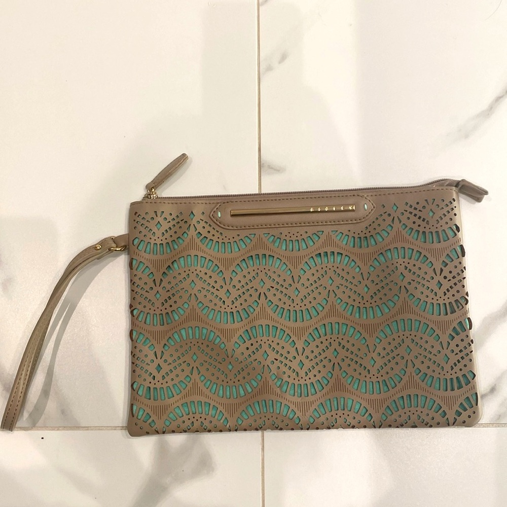 Sisley laser cut beige and mint pouch.